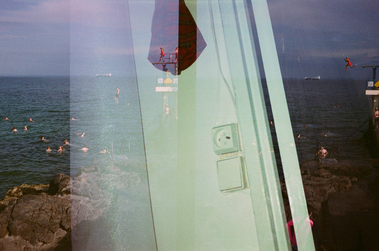 double exposure of blackrock diving tower and a window